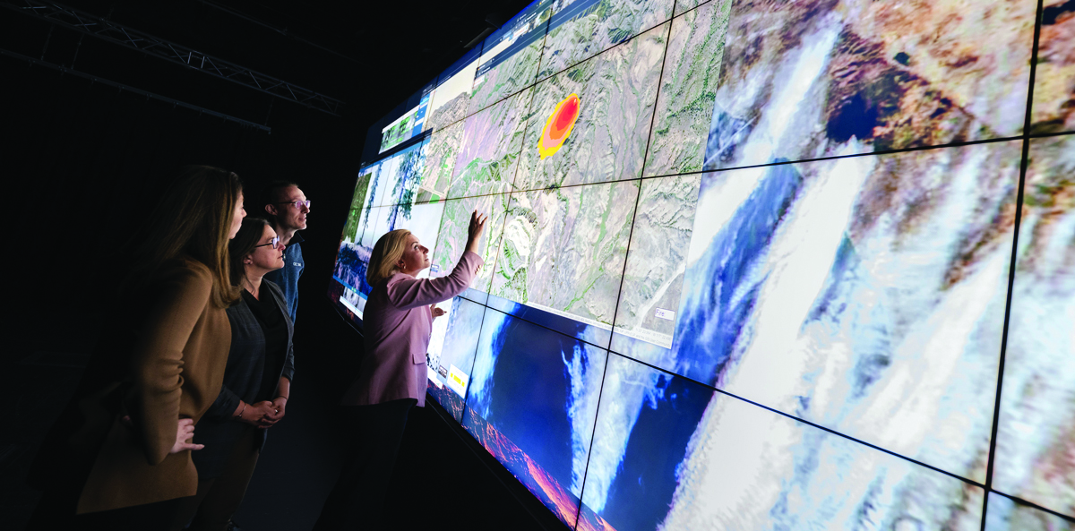 cac250312WIFIRE_DSC_7297ErikJepsenUCSanDiego6_1 WIFIRE team members, led by Ilkay Altintas (far right), integrate many data sources to model wildfire behavior, providing real-time predictive maps to first responders. (Photo by Erik Jepsen, UC San Diego)