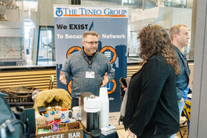 The Teneo Group explaining to attendee